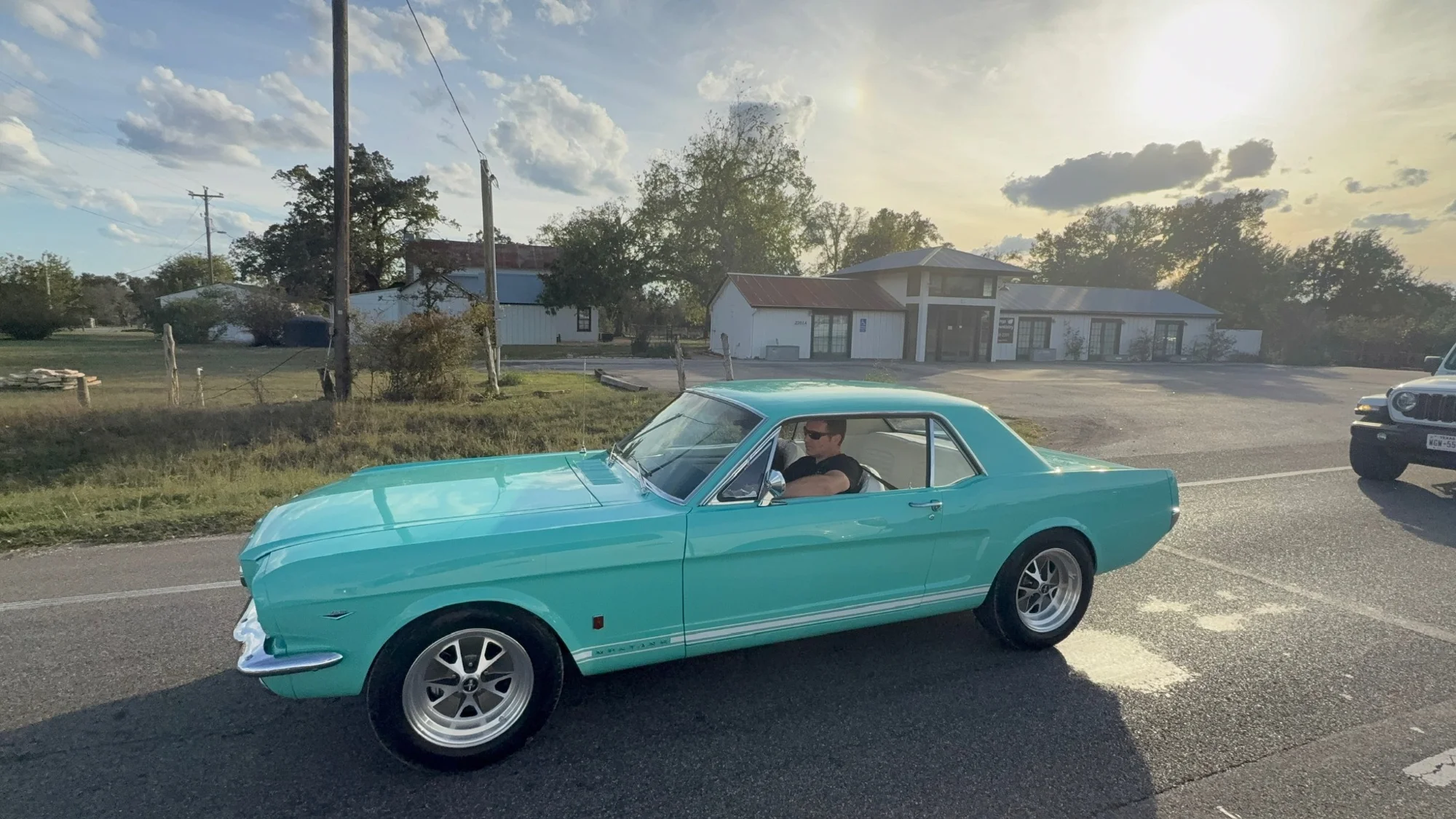 Vivian, the turquoise 1966 Mustang, out on the road